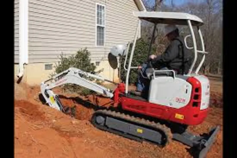 Takeuchi TB216 Mini Excavator – Power and Versatility in Compact Spaces  